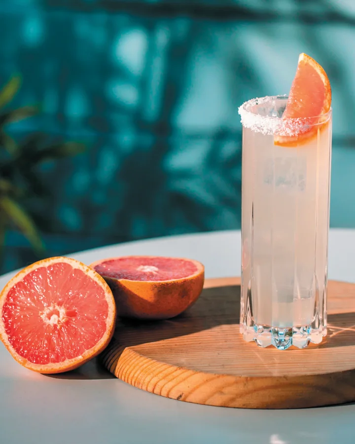 De Nada Paloma in a tall glass with a salt rim and grapefruit wedge