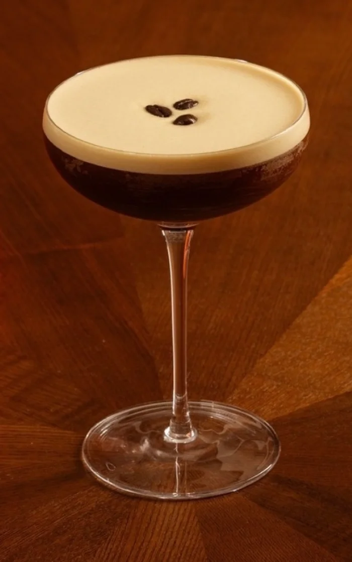 Espresso Martini in a coupe topped with three coffee beans