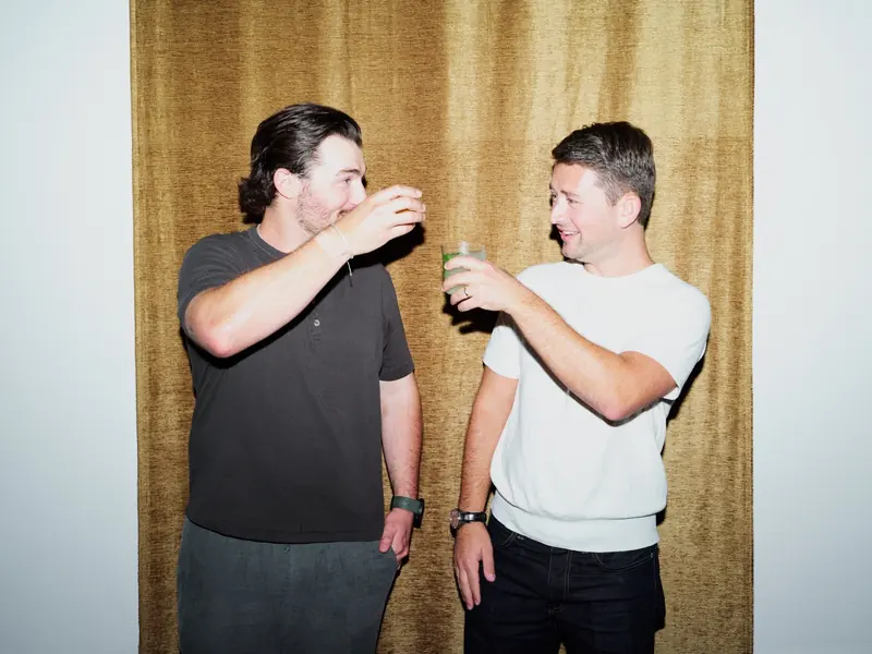 Danny and Adam, the founders, raising a glass