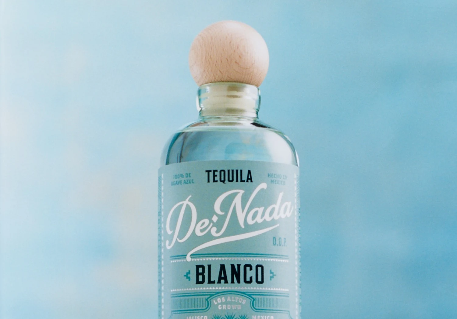 De Nada Blanco, the wooden stopper and the label, shot on film against a pale blue wall